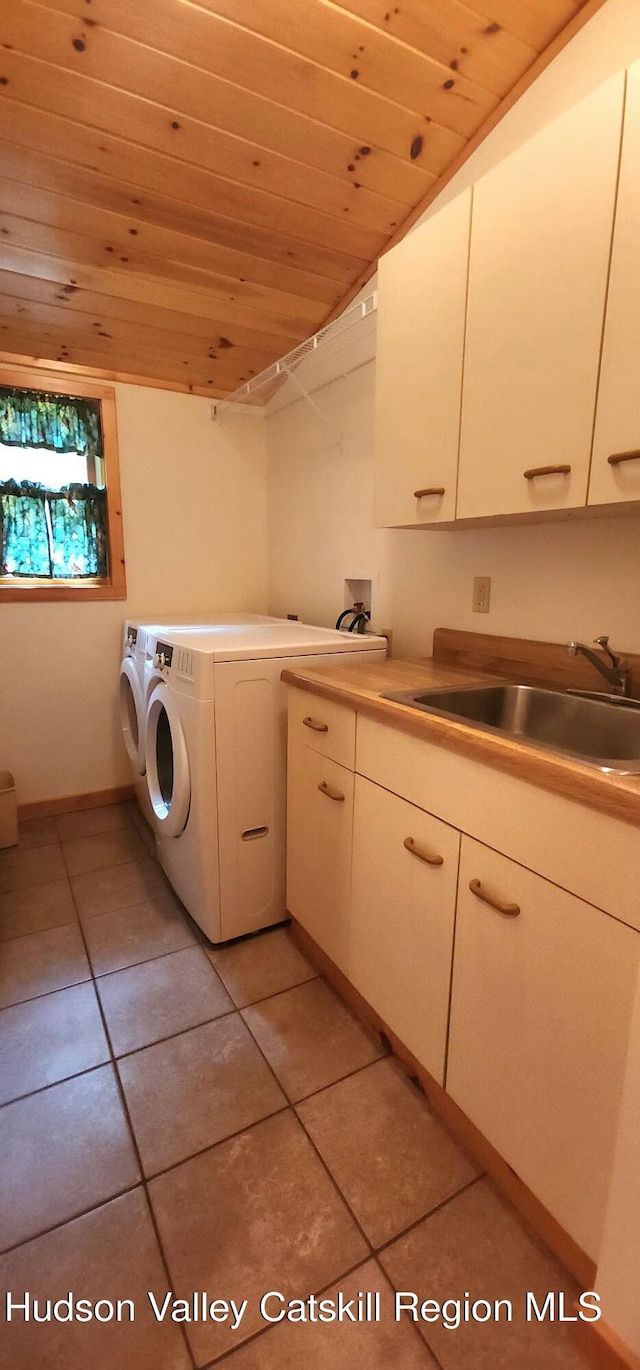 69 June Lodge Dr, Hunter, NY 12442 - laundry area featuring wood ceiling, cabinet space, washer and dryer, and light tile patterned floors