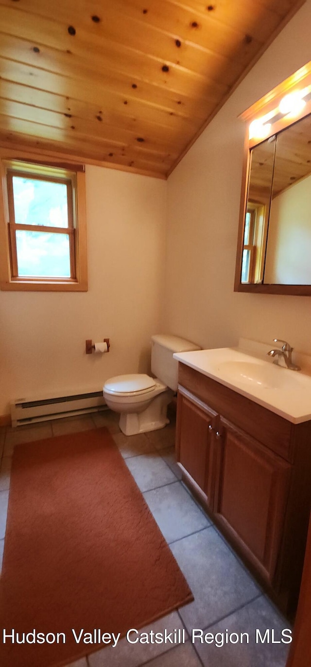 69 June Lodge Dr, Hunter, NY 12442 - bathroom featuring baseboard heating, wood ceiling, vanity, vaulted ceiling, and tile patterned floors