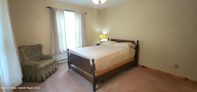 69 June Lodge Dr, Hunter, NY 12442 - bedroom with baseboard heating and light carpet