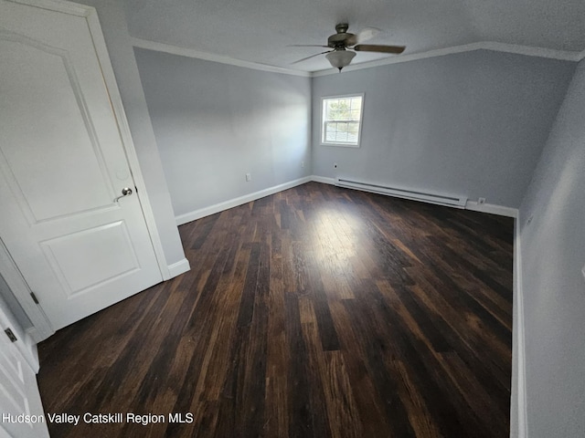 empty room with baseboards, a baseboard heating unit, dark wood-style floors, a ceiling fan, and crown molding