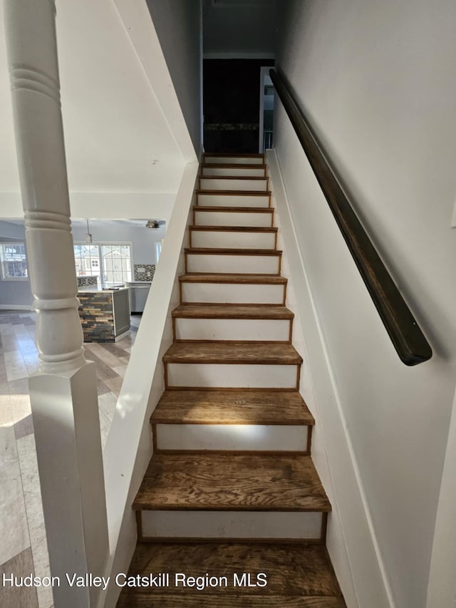 stairs featuring decorative columns