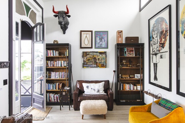 sitting room featuring light hardwood / wood-style floors