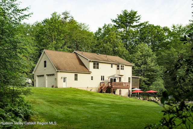 214 Wright Rd, Kerhonkson, NY 12446 - back of house with stairs, a garage, a wooden deck, a yard, and a shingled roof