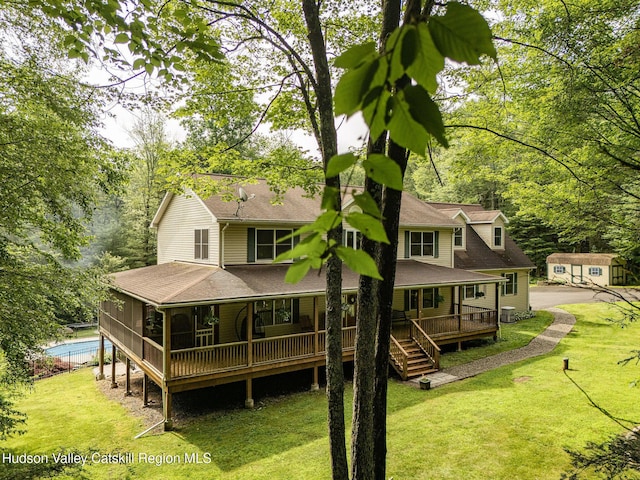 214 Wright Rd, Kerhonkson, NY 12446 - rear view of property featuring a shingled roof, a yard, and a porch