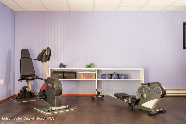 214 Wright Rd, Kerhonkson, NY 12446 - workout area featuring a paneled ceiling, wood finished floors, and baseboard heating