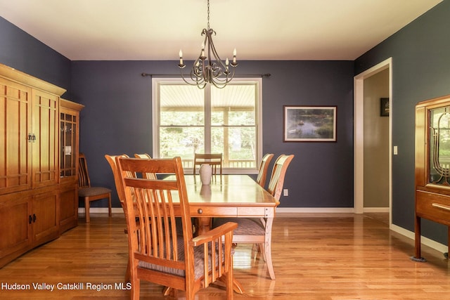 214 Wright Rd, Kerhonkson, NY 12446 - dining area featuring a chandelier and light wood-type flooring
