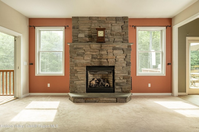 214 Wright Rd, Kerhonkson, NY 12446 - unfurnished living room with a fireplace, healthy amount of natural light, and carpet floors