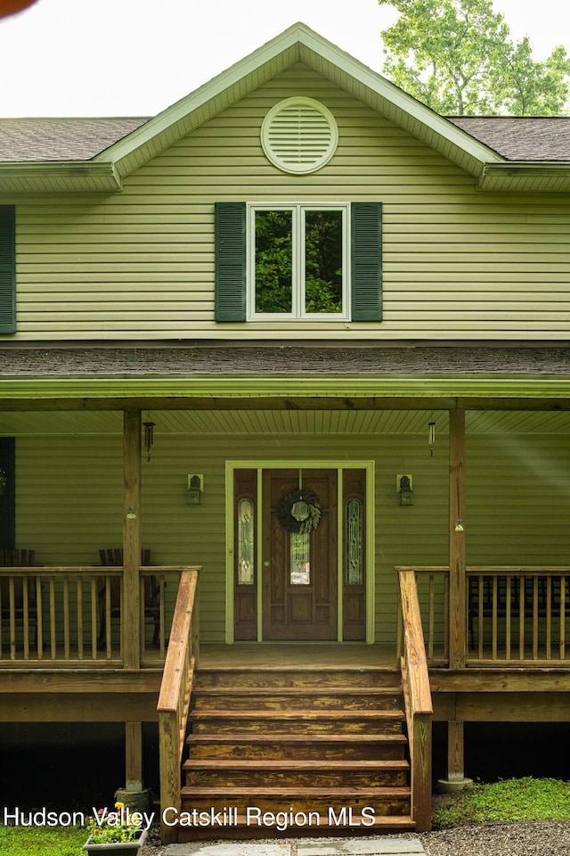 214 Wright Rd, Kerhonkson, NY 12446 - view of front facade with a porch and a shingled roof