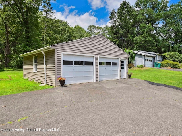 garage with a yard