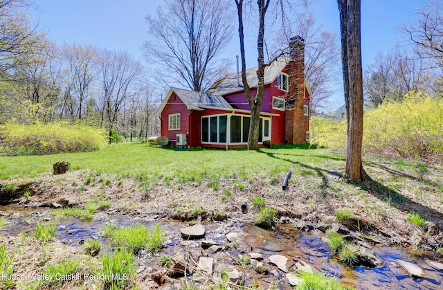 view of yard with a sunroom