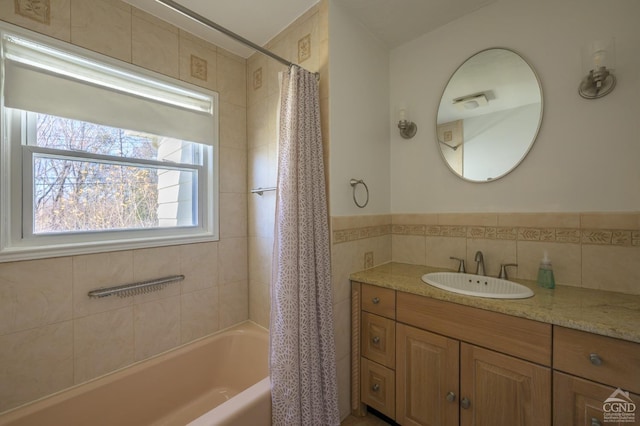 25 Joslen Pl, Hudson, NY 12534 - full bath with tile walls, vanity, and shower / bath combo with shower curtain