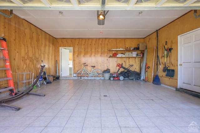 25 Joslen Pl, Hudson, NY 12534 - garage with wood walls and a garage door opener