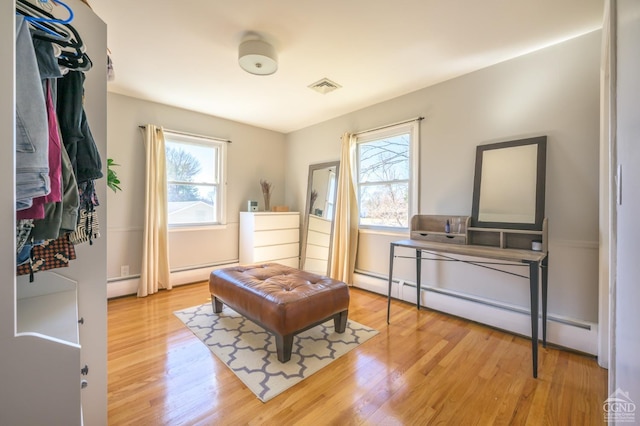 25 Joslen Pl, Hudson, NY 12534 - sitting room with wood finished floors and a baseboard heating unit