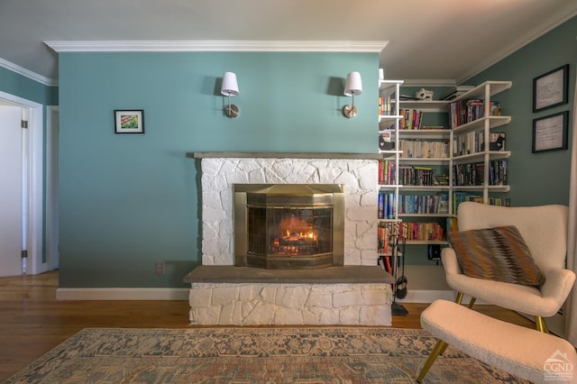 25 Joslen Pl, Hudson, NY 12534 - sitting room featuring crown molding, wood finished floors, a fireplace, and baseboards