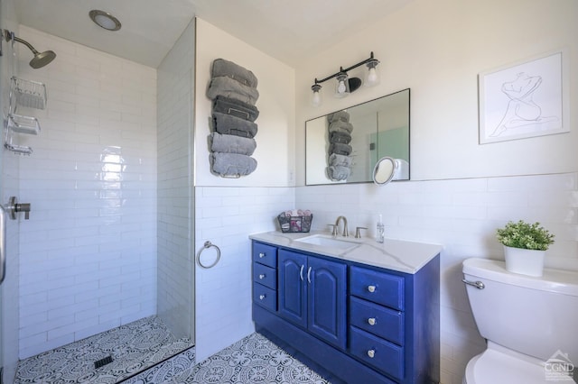 25 Joslen Pl, Hudson, NY 12534 - full bathroom featuring tile walls, toilet, vanity, a tile shower, and tile patterned floors