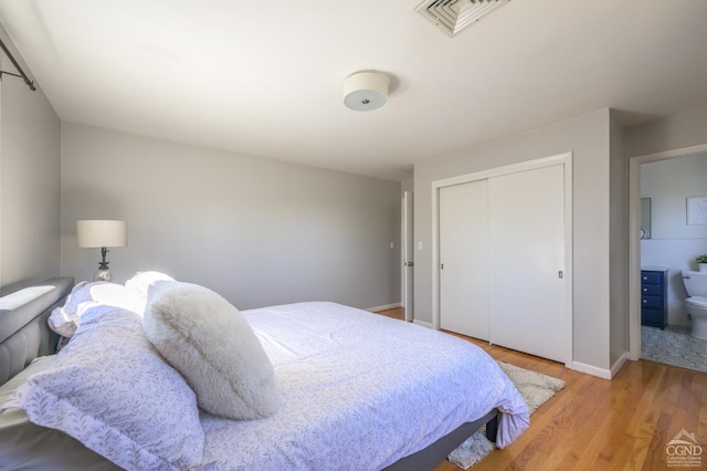 25 Joslen Pl, Hudson, NY 12534 - bedroom with light wood finished floors, a closet, and baseboards