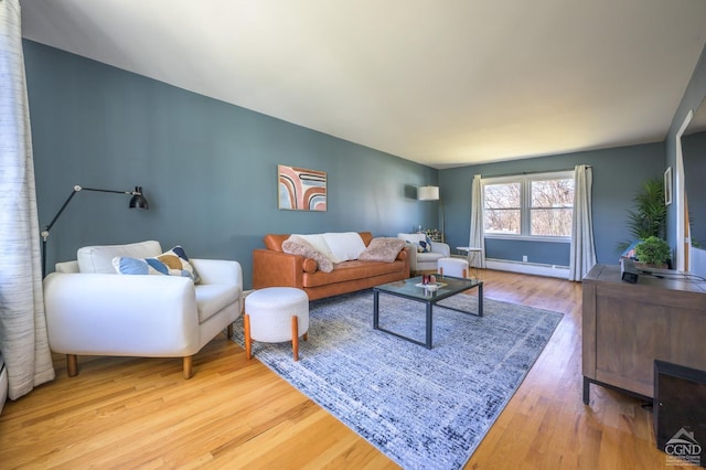 25 Joslen Pl, Hudson, NY 12534 - living room with a baseboard radiator, wood finished floors, and baseboards