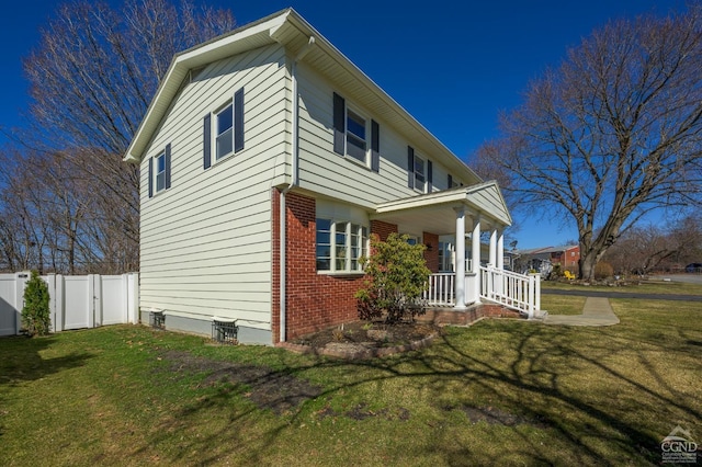 25 Joslen Pl, Hudson, NY 12534 - view of home's exterior featuring covered porch and brick siding