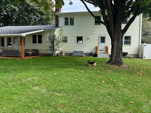 25 Joslen Pl, Hudson, NY 12534 - rear view of property with a chimney, entry steps, outdoor lounge area, and a patio