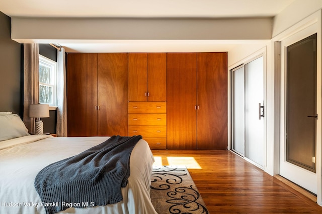 bedroom with wood finished floors