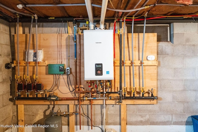 utility room with tankless water heater