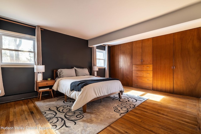 bedroom with wood finished floors