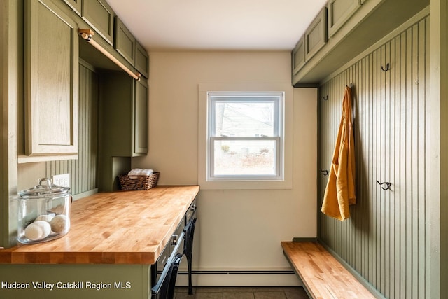 mudroom with tile patterned floors and a baseboard radiator