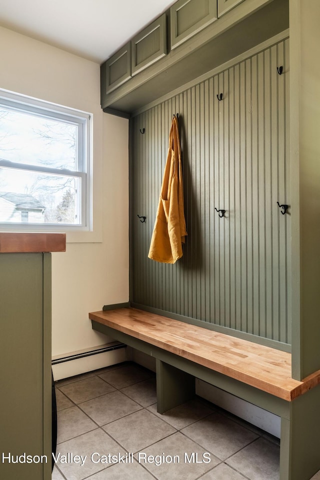 mudroom featuring tile patterned floors and baseboard heating