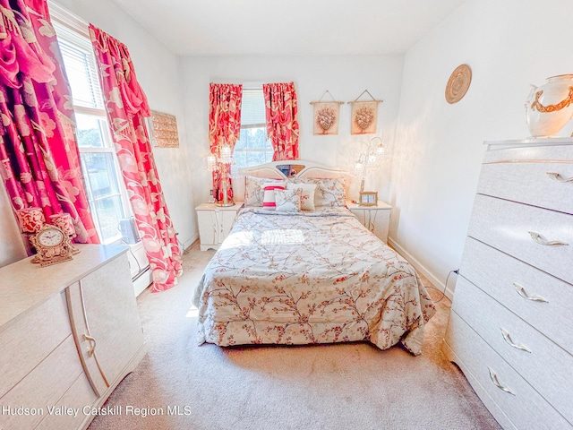 bedroom with light colored carpet