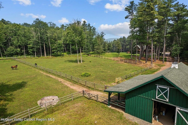 surrounding community featuring a rural view and an outdoor structure