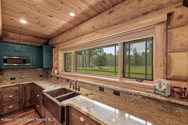 kitchen featuring light stone countertops, sink, wooden ceiling, dark hardwood / wood-style floors, and backsplash