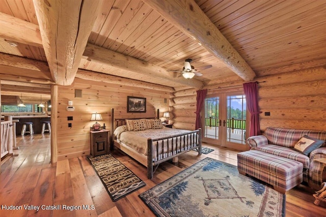 bedroom featuring access to exterior, french doors, wooden ceiling, beamed ceiling, and light hardwood / wood-style floors