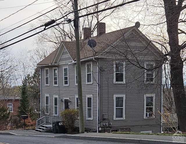 36 Spring St, Chatham, NY 12037 - view of front of property featuring a chimney and roof with shingles