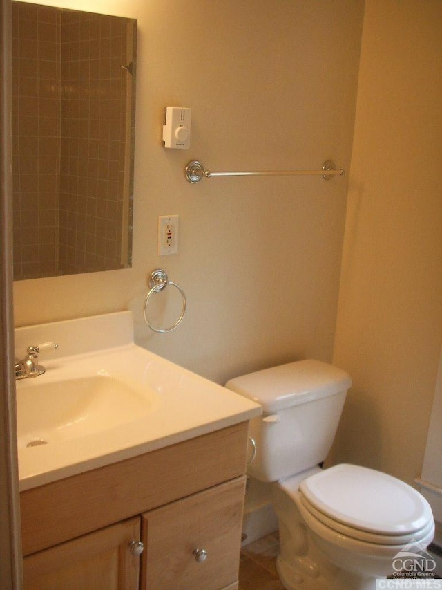 36 Spring St, Chatham, NY 12037 - bathroom with vanity, toilet, a shower, and tile patterned flooring