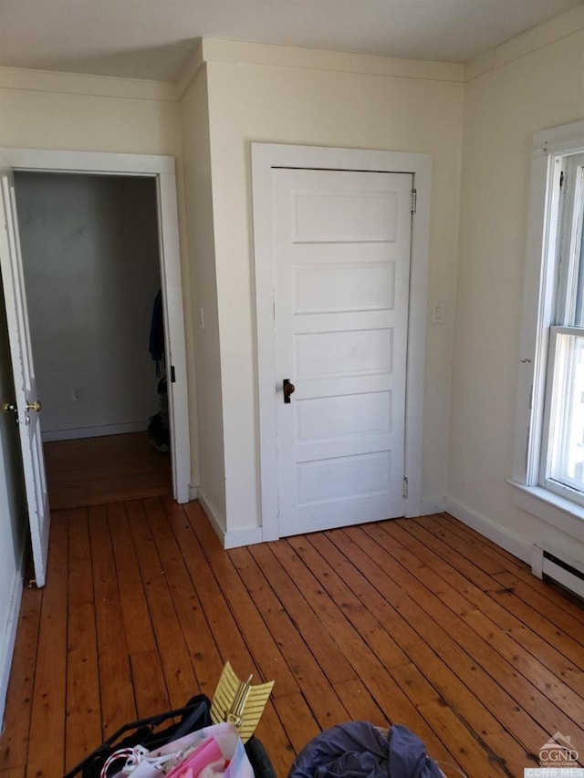 36 Spring St, Chatham, NY 12037 - unfurnished bedroom with hardwood / wood-style flooring and baseboards