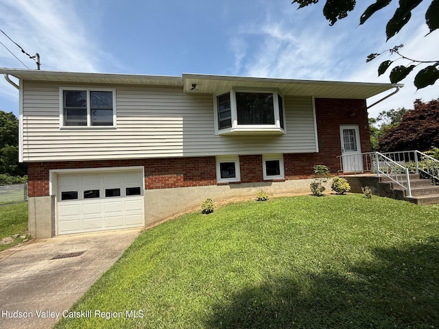 39 Maple Ln, Dover Plains, NY 12522 - view of front of property featuring a garage, a front lawn, concrete driveway, and brick siding