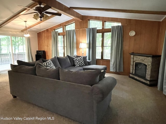 7 Dixon Ave, Woodstock, NY 12498 - carpeted living area featuring wood walls, ceiling fan, and a stone fireplace