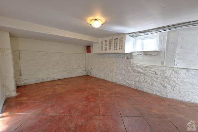 below grade area with tile patterned floors