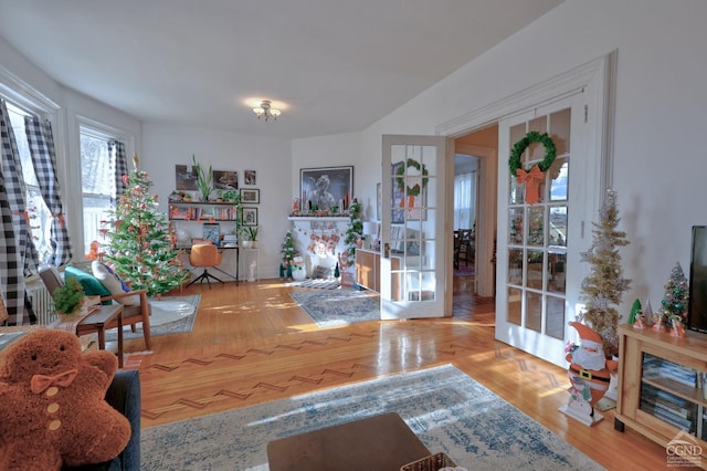 sitting room with french doors and wood finished floors