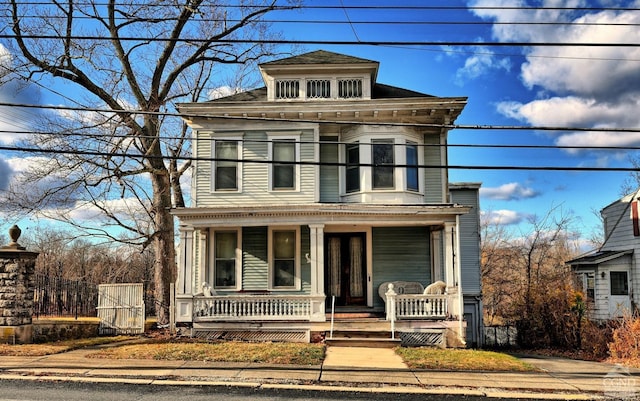 view of front of property featuring covered porch