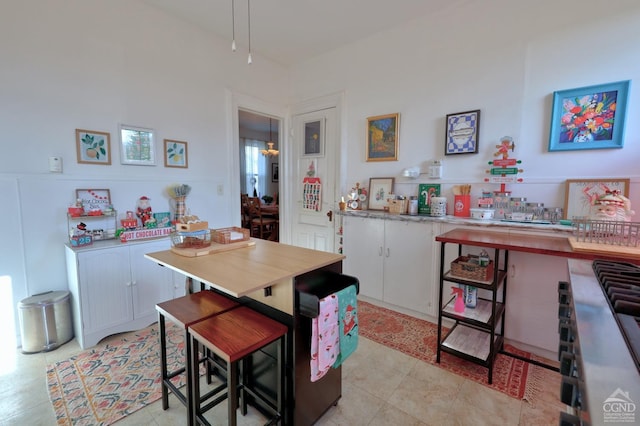 kitchen with light countertops and white cabinets