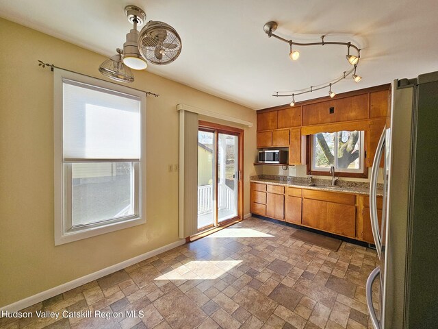 kitchen with sink and appliances with stainless steel finishes