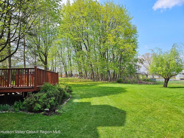 view of yard with a wooden deck