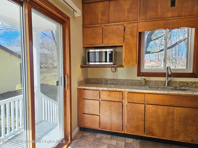 kitchen with sink and a wealth of natural light