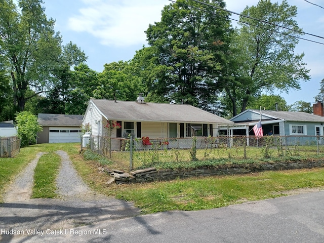 14 Center Rd, High Falls, NY 12440 - single story home with a porch, driveway, a fenced front yard, a garage, and an outdoor structure