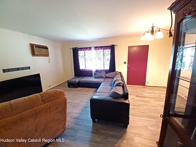 14 Center Rd, High Falls, NY 12440 - living room with wood finished floors, healthy amount of natural light, a chandelier, and a wall unit AC