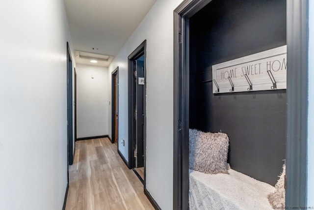 hallway featuring recessed lighting and wood finished floors