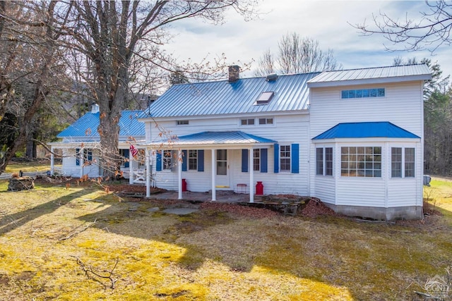 161 Beaver Hill Rd, Gilboa, NY 12076 - rear view of property with a chimney, a porch, and metal roof