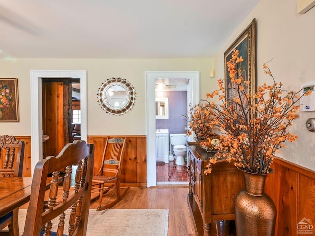 161 Beaver Hill Rd, Gilboa, NY 12076 - dining room with wainscoting, wood finished floors, and wood walls