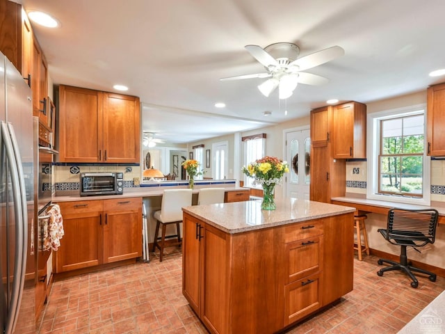 161 Beaver Hill Rd, Gilboa, NY 12076 - kitchen featuring brick patterned floors, a ceiling fan, a kitchen island, plenty of natural light, and recessed lighting